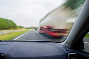 red truck speeding down the road