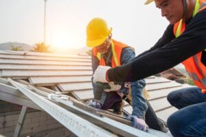 construction workers building a roof