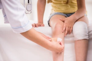 child getting bandaged up