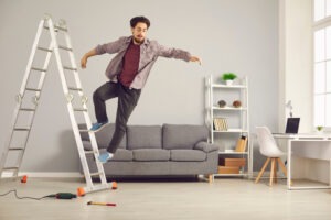 man falling off ladder