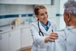 female doctor comforting male patient