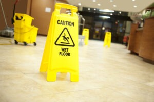 several wet floor signs in a lobby