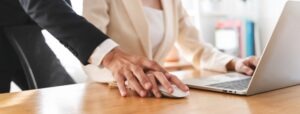 man holding woman’s hand on mouse