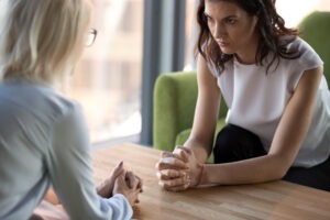 young woman talking to hr woman